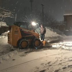 plowing with small bulldozer.